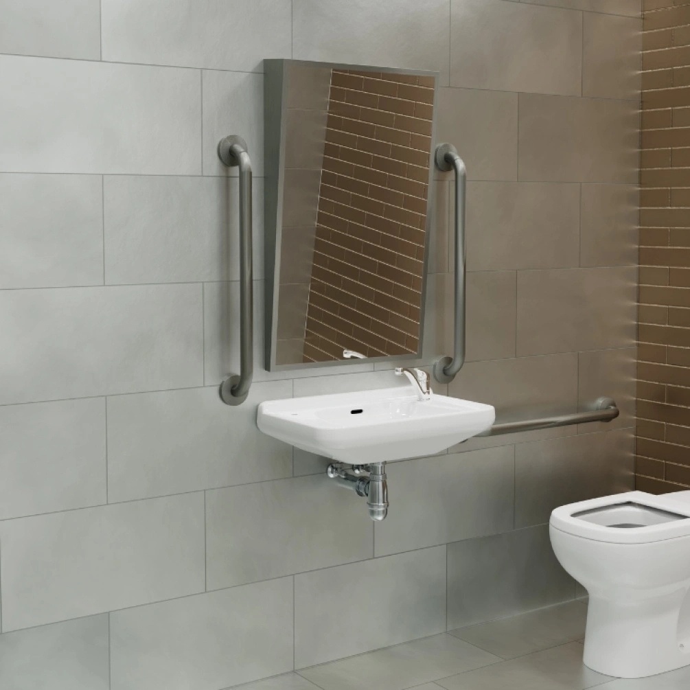 Product Lifestyle image of the Origins Living Docklands 500mm x 800mm Brushed Stainless Steel Inclusive Angled Mirror mounted on the wall of an adapted bathroom DKL-00A058-BS